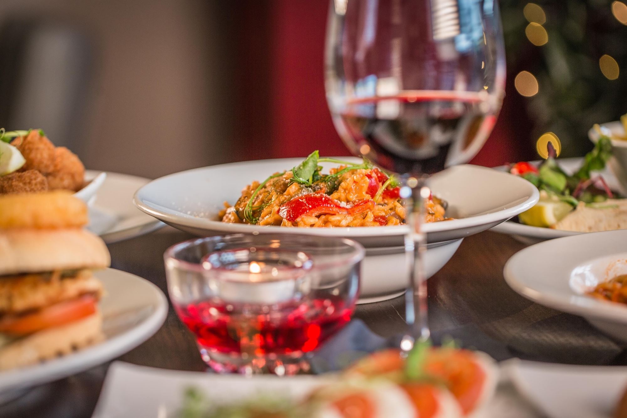 Risotto served with a glass of red wine at Rosa Twelve