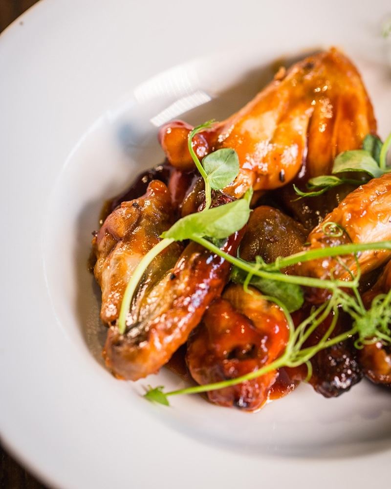 Sticky glazed chicken wings at Rosa Twelve