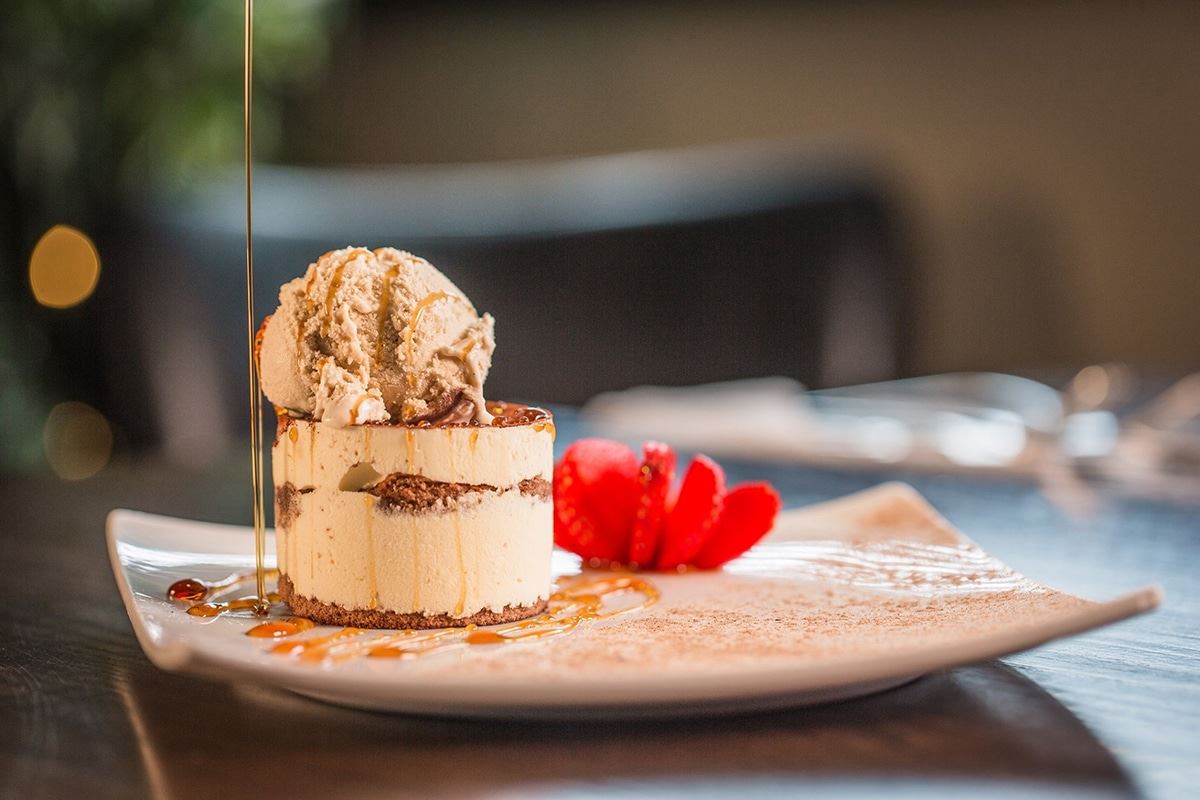 Tiramisu served with a scoop of ice cream
