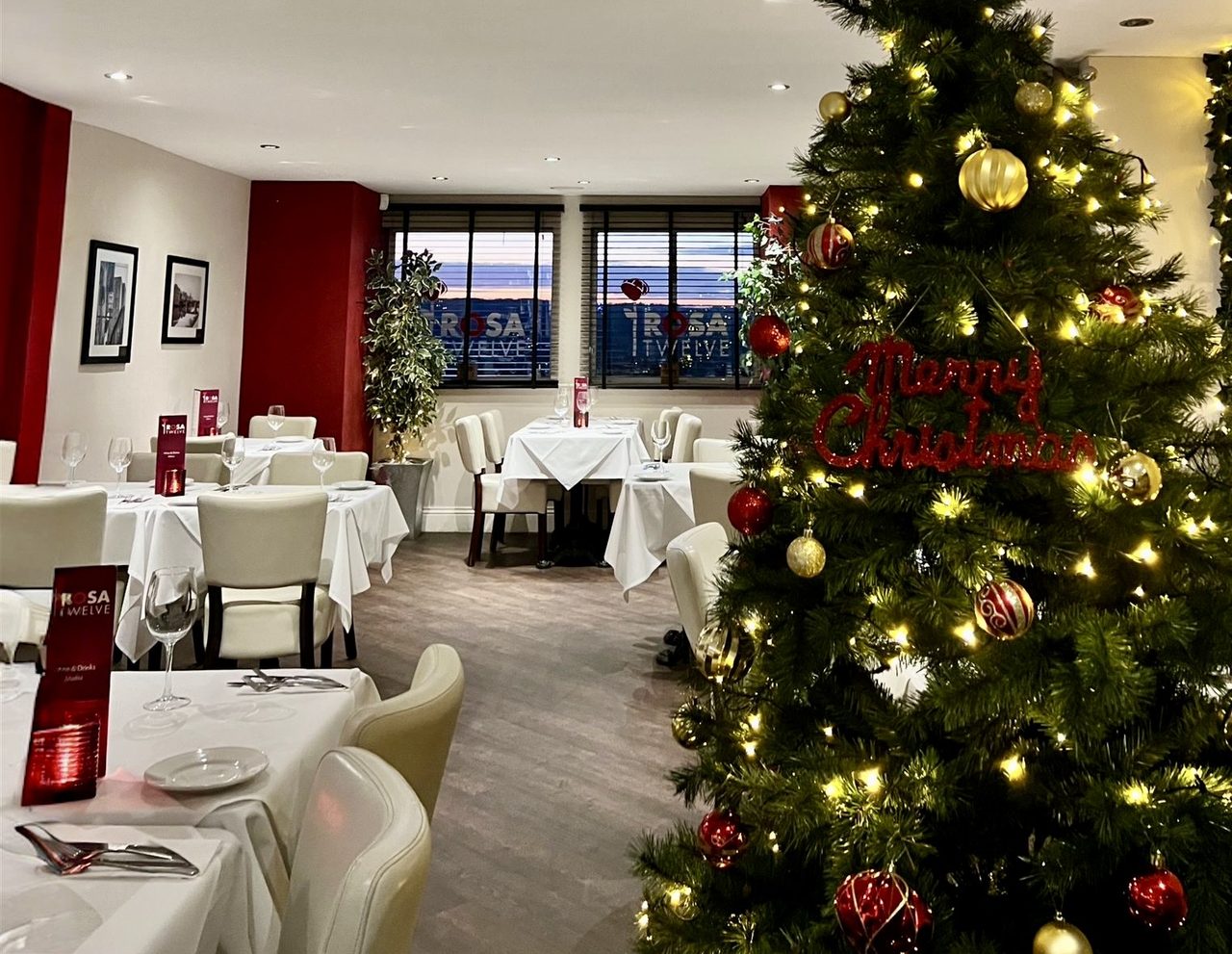The Rosa Twelve dining room dressed with a Christmas tree